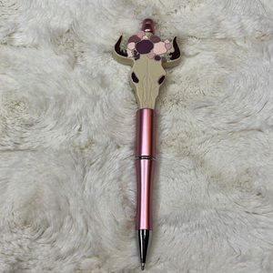 Handcrafted beaded pen. Pink floral cow skull. Made with bpa free silicone beads